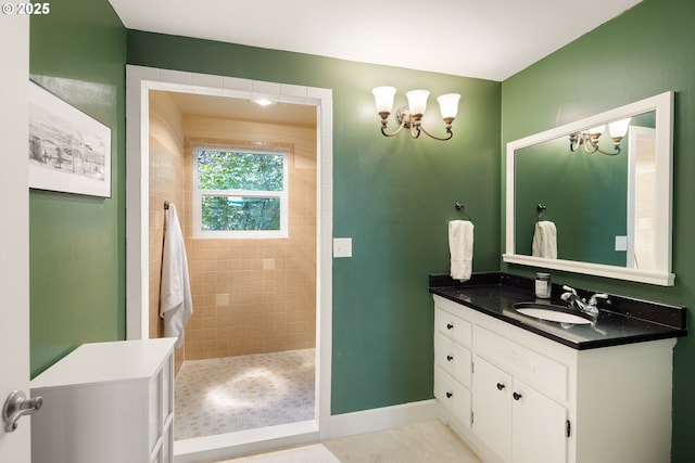 2977 Ingalls Way, Eugene, OR 97405 - bathroom featuring vanity, a chandelier, walk in shower, baseboards, and tile patterned flooring
