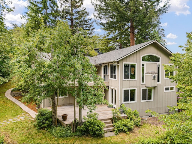 2977 Ingalls Way, Eugene, OR 97405 - view of front of property with a deck, roof with shingles, board and batten siding, and a patio area