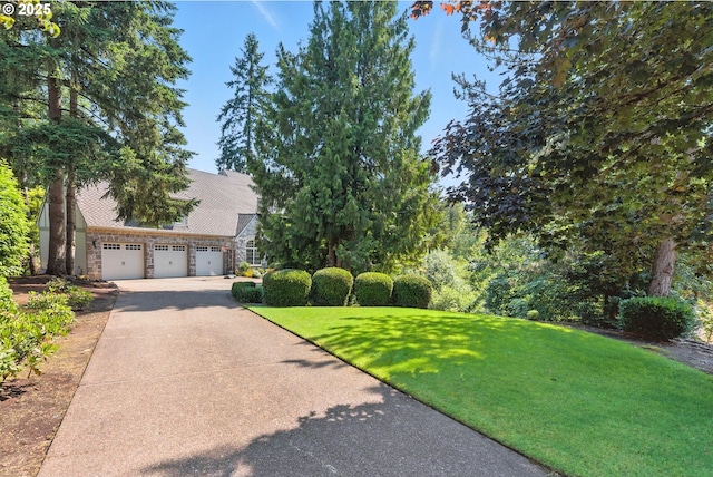 2812 Beacon Hill Dr, West Linn, OR 97068 - view of front of house featuring concrete driveway, a front yard, and stone siding