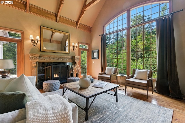 2812 Beacon Hill Dr, West Linn, OR 97068 - living room featuring high vaulted ceiling, hardwood / wood-style floors, beam ceiling, and a high end fireplace