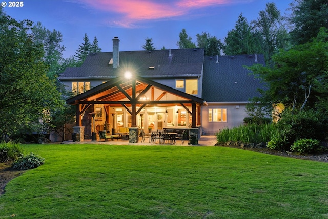 2812 Beacon Hill Dr, West Linn, OR 97068 - rear view of house featuring a chimney, a lawn, and a patio area