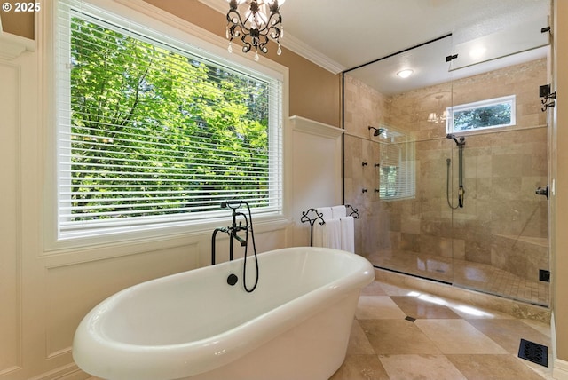 2812 Beacon Hill Dr, West Linn, OR 97068 - full bath with a freestanding tub, a shower stall, crown molding, tile patterned floors, and a chandelier