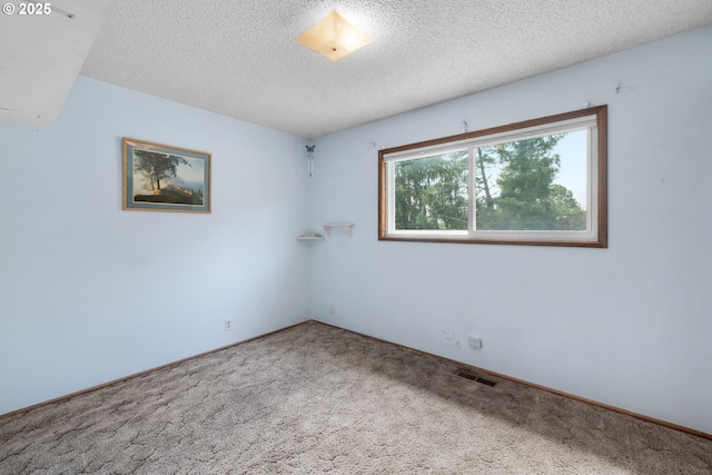 44505 SW Knight Rd, Gaston, OR 97119 - unfurnished room with carpet flooring and a textured ceiling