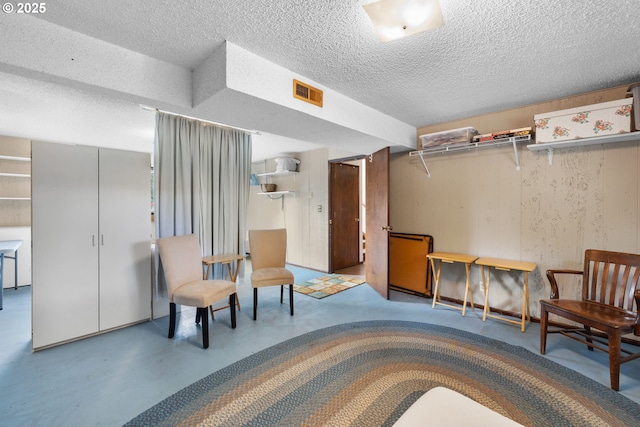 44505 SW Knight Rd, Gaston, OR 97119 - sitting room featuring a textured ceiling and concrete flooring