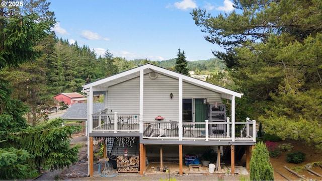 44505 SW Knight Rd, Gaston, OR 97119 - rear view of house featuring a deck and a forest view