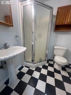 34085 Berg Rd, Warren, OR 97053 - full bathroom featuring tile patterned floors, toilet, and a shower stall