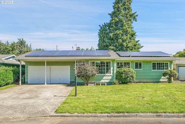 4803 SE Fieldcrest Dr, Milwaukie, OR 97222 - ranch-style home with a garage, a front lawn, driveway, and solar panels