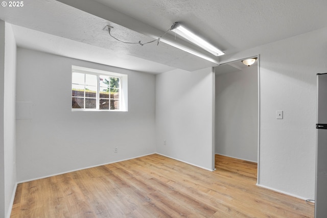 4803 SE Fieldcrest Dr, Milwaukie, OR 97222 - below grade area featuring wood finished floors and a textured ceiling