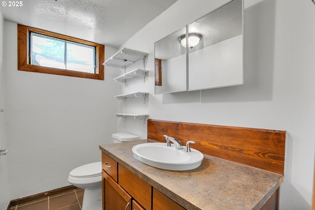 4803 SE Fieldcrest Dr, Milwaukie, OR 97222 - half bathroom featuring vanity, toilet, tile patterned floors, and baseboards