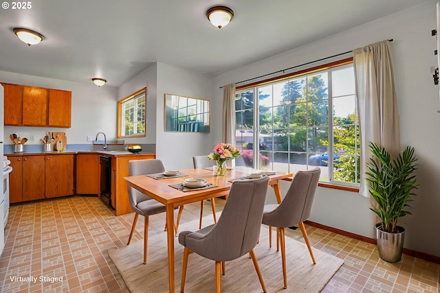 4803 SE Fieldcrest Dr, Milwaukie, OR 97222 - dining area with brick patterned flooring, plenty of natural light, and baseboards