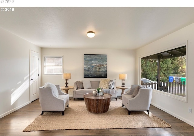 2747 NE Bryant St, Portland, OR 97211 - living area with healthy amount of natural light, wood finished floors, and baseboards
