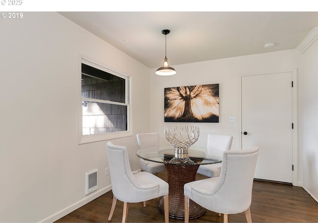 2747 NE Bryant St, Portland, OR 97211 - dining space featuring dark wood-style flooring and baseboards