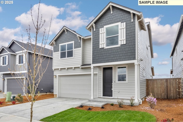 4205 NE 186th St Lot 265, Vancouver, WA 98686 - view of front of home featuring an attached garage, concrete driveway, and fence
