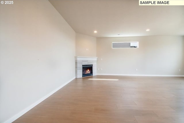 4205 NE 186th St Lot 265, Vancouver, WA 98686 - unfurnished living room featuring wood finished floors, recessed lighting, baseboards, and a fireplace
