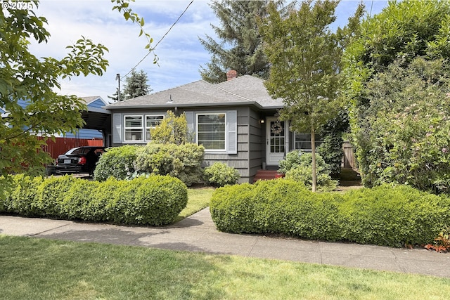 6325 SE 77th Ave SE, Portland, OR 97206 - view of front of home with a chimney and roof with shingles