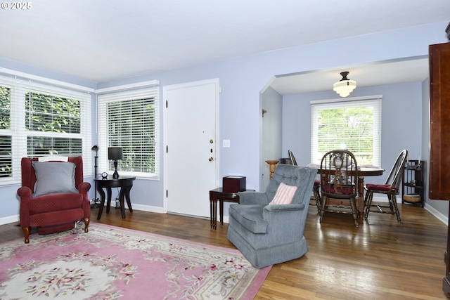 6325 SE 77th Ave SE, Portland, OR 97206 - living room featuring arched walkways and wood finished floors