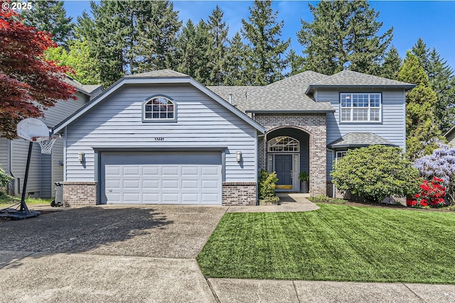 view of front facade with a front lawn, brick siding, a shingled roof, an attached garage, and driveway