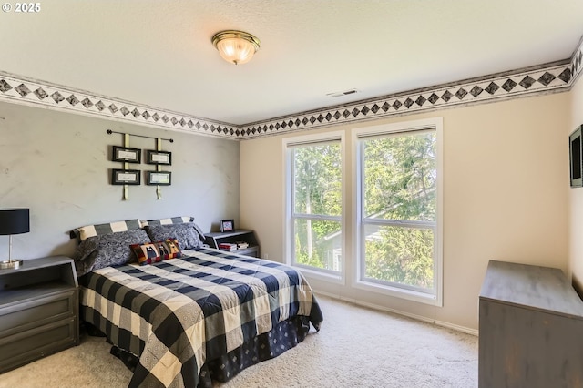 carpeted bedroom with visible vents