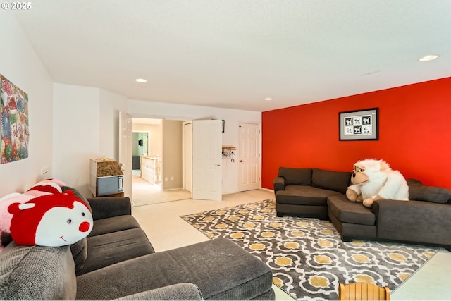 living area featuring carpet and recessed lighting