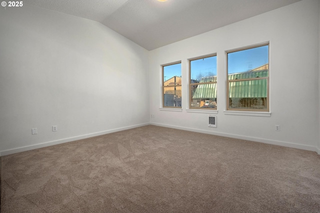 4409 NE Killingsworth St Unit 103, Portland, OR 97218 - unfurnished room with carpet flooring and vaulted ceiling