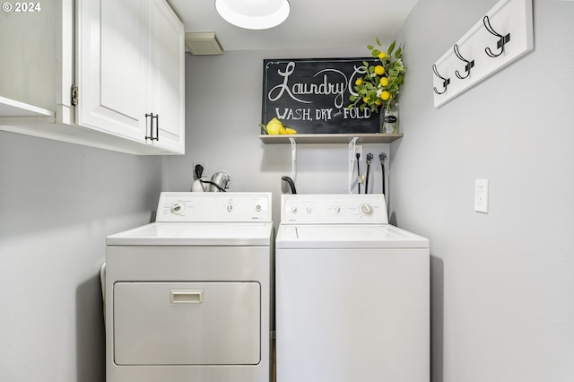 laundry area with cabinet space and independent washer and dryer