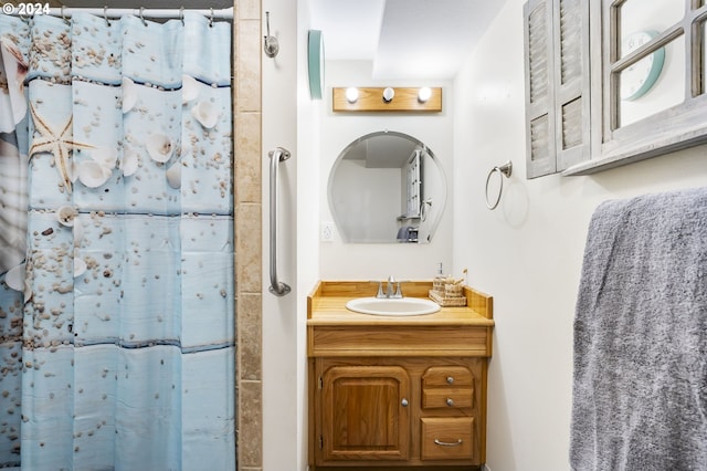 full bath with a shower with curtain and vanity