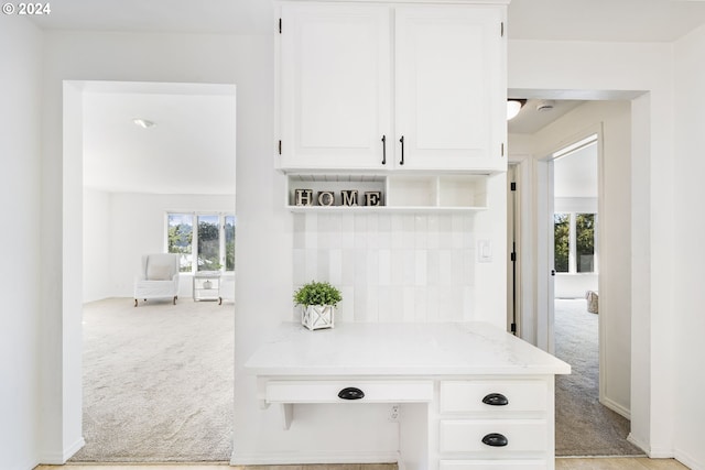 mudroom featuring light colored carpet