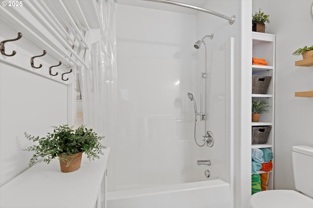 full bath featuring toilet and shower / bath combination with curtain