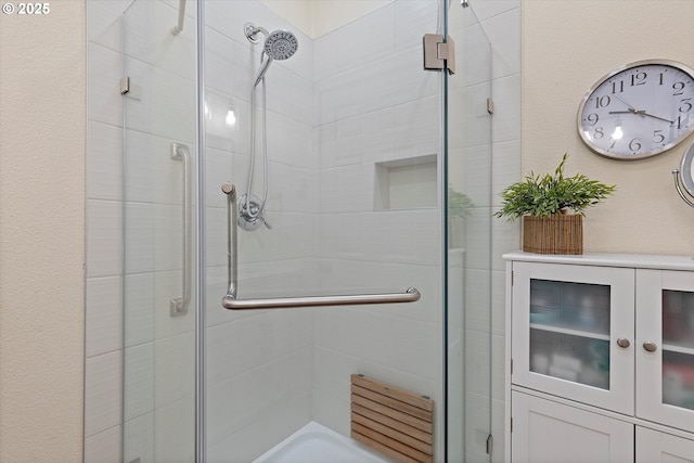 full bathroom featuring a shower stall