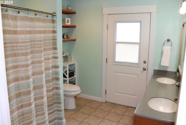 4718 NE 129th Ave, Vancouver, WA 98682 - full bath with double vanity, tile patterned flooring, toilet, and curtained shower