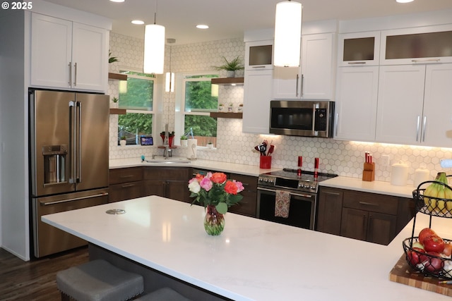 4718 NE 129th Ave, Vancouver, WA 98682 - kitchen featuring stainless steel appliances, open shelves, light countertops, white cabinetry, and recessed lighting