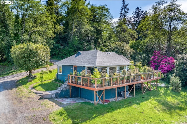 12990 I St, Nehalem, OR 97131 - rear view of house with a yard, a deck, roof with shingles, and driveway