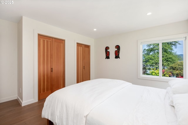 12990 I St, Nehalem, OR 97131 - bedroom with wood finished floors, recessed lighting, two closets, and baseboards