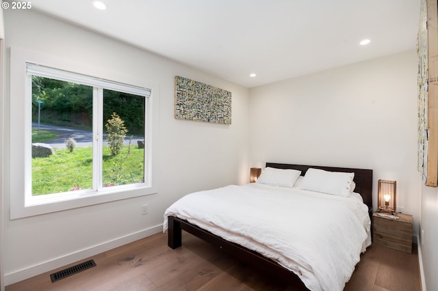 12990 I St, Nehalem, OR 97131 - bedroom with radiator, wood finished floors, recessed lighting, and baseboards