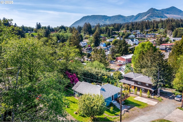12990 I St, Nehalem, OR 97131 - aerial view of residential area featuring a mountain backdrop