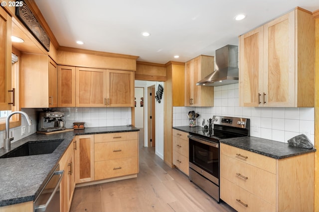 12990 I St, Nehalem, OR 97131 - kitchen featuring appliances with stainless steel finishes, wall chimney exhaust hood, light brown cabinetry, a sink, and recessed lighting