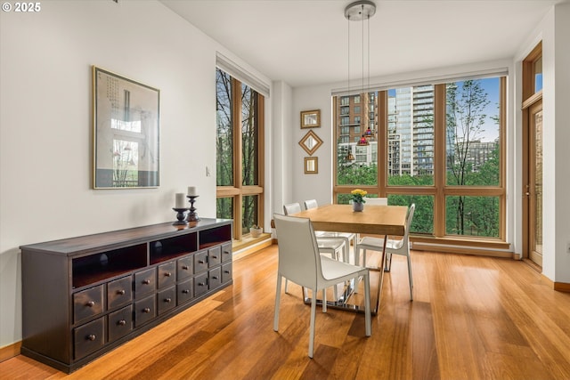 1030 NW Johnson St Unit 323, Portland, OR 97209 - dining space with light wood finished floors