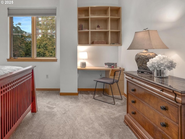 1030 NW Johnson St Unit 323, Portland, OR 97209 - carpeted bedroom featuring baseboards and a desk