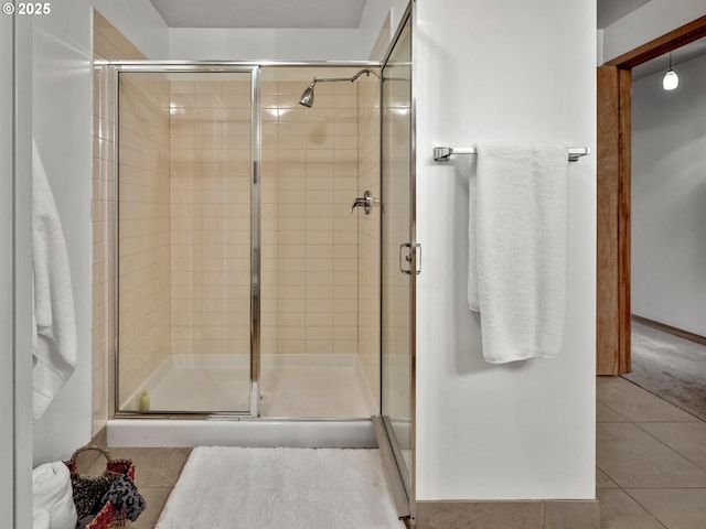 1030 NW Johnson St Unit 323, Portland, OR 97209 - bathroom featuring tile patterned flooring and a stall shower
