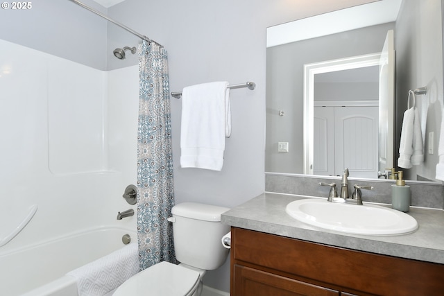 full bathroom with shower / tub combo with curtain, vanity, and toilet