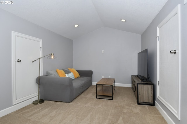 living room with light colored carpet and vaulted ceiling