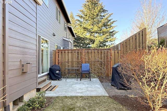 view of patio featuring a grill