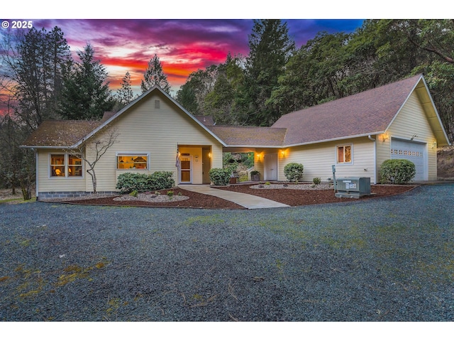 view of front of house featuring cooling unit and a garage
