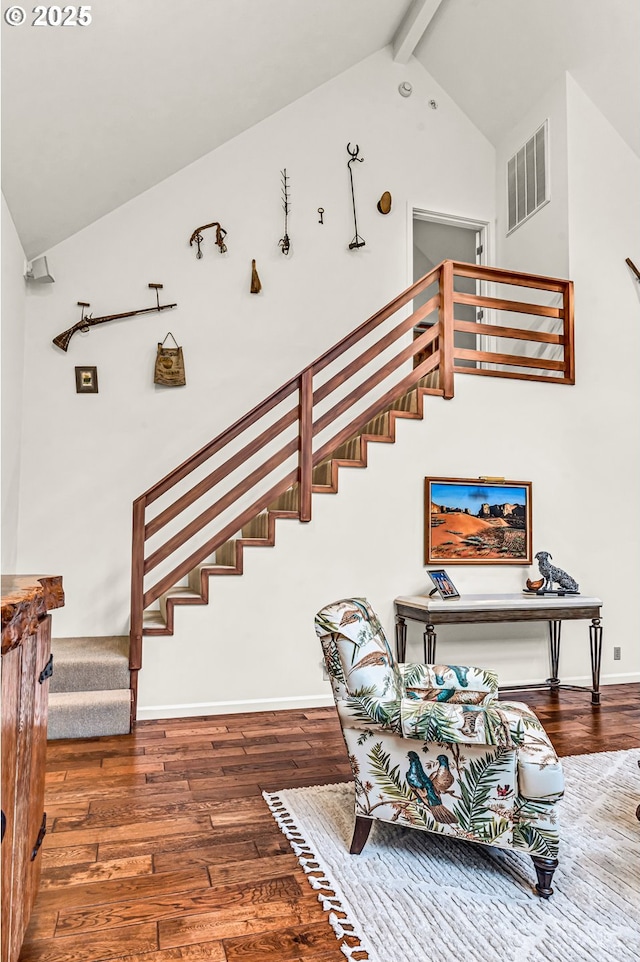 780 Pinecrest Dr, Grants Pass, OR 97526 - stairs with beam ceiling, high vaulted ceiling, baseboards, wood finished floors, and visible vents