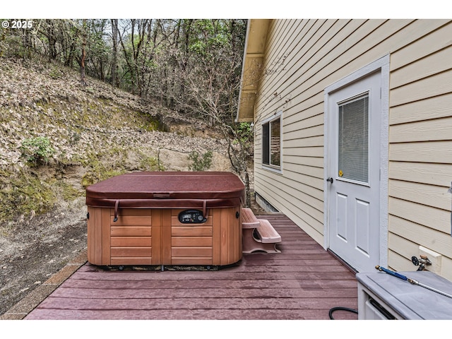 deck with a hot tub