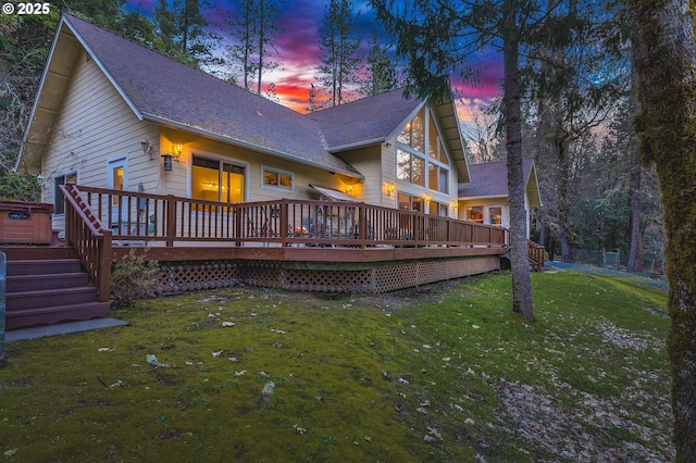 780 Pinecrest Dr, Grants Pass, OR 97526 - back of house at dusk with a wooden deck and a yard