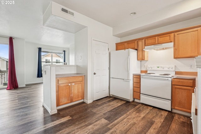 kitchen featuring white appliances, visible vents, under cabinet range hood, light countertops, and dark wood-style floors