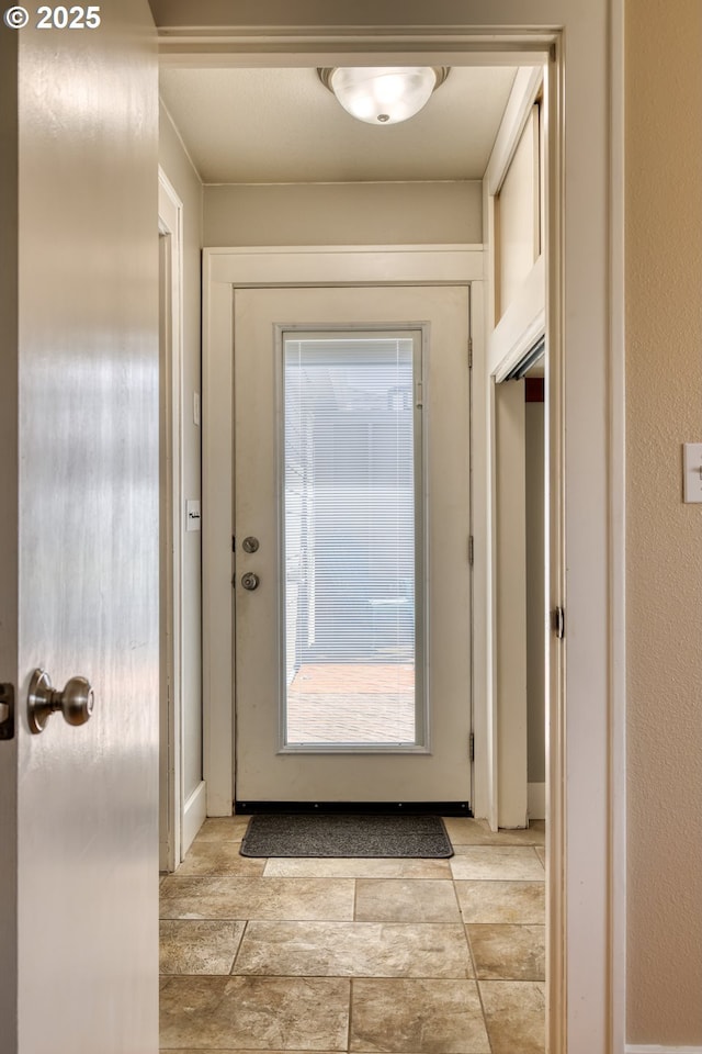 1732 Hayes St, North Bend, OR 97459 - entryway featuring baseboards and stone finish floor