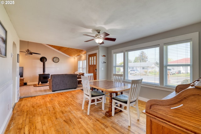 1732 Hayes St, North Bend, OR 97459 - dining area featuring light wood-style floors, a wood stove, and ceiling fan
