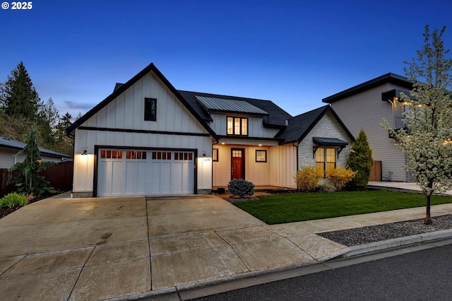 modern farmhouse style home featuring board and batten siding, driveway, and a front lawn